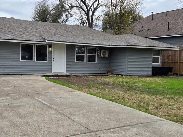 a view of house with yard