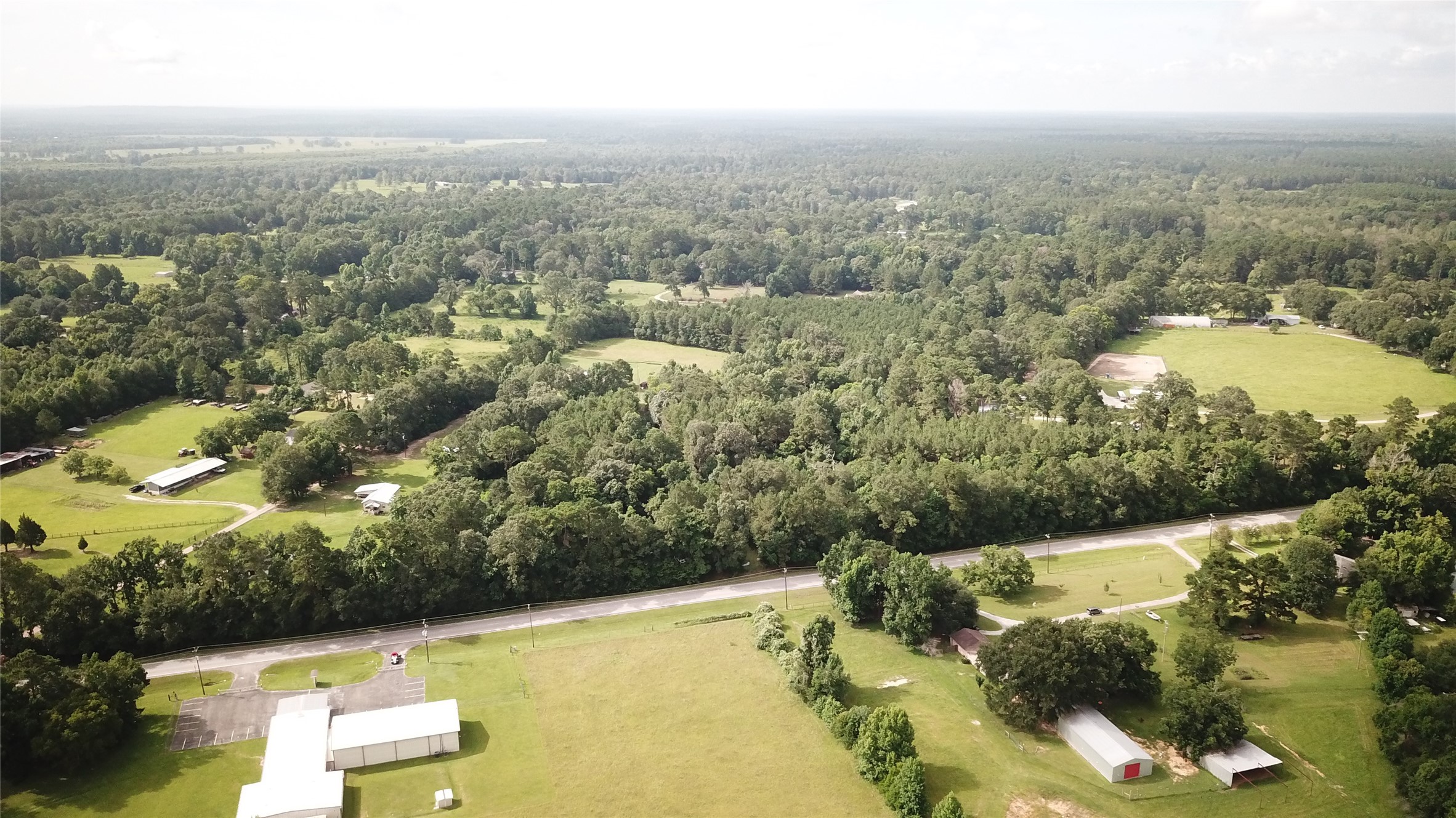 0 Fm-787 Cleveland, TX 77327 - Photo 1 of 9 an aerial view of residential houses with outdoor space and trees