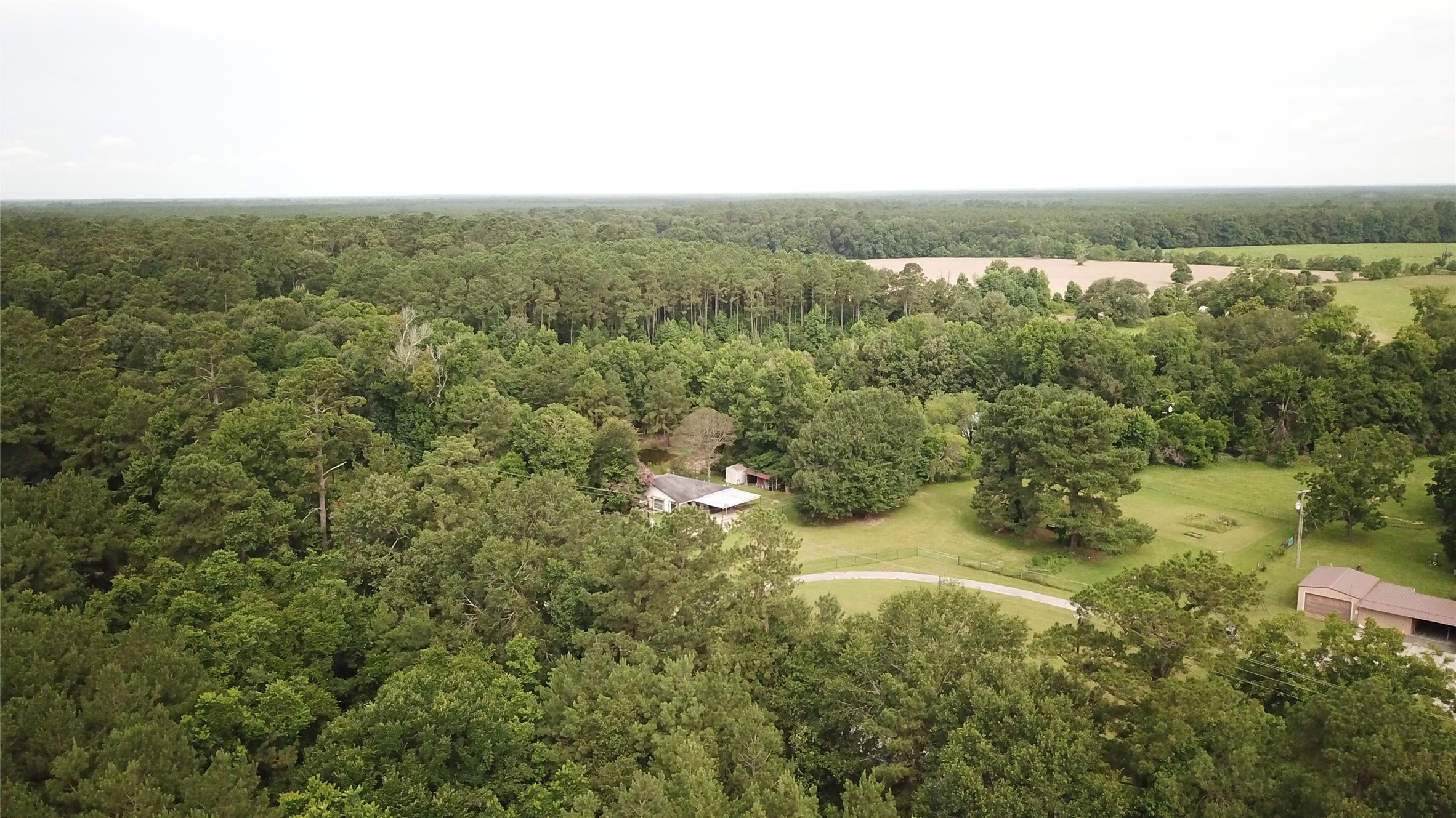 0 Fm-787 Cleveland, TX 77327 - Photo 8 of 9 a view of a city with lush green forest