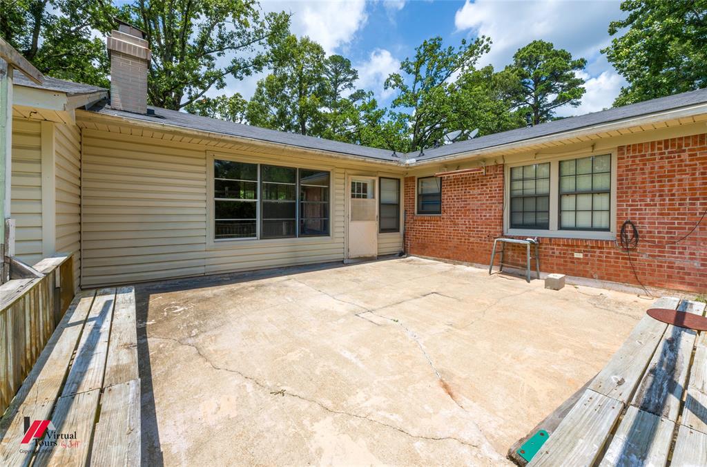 3109 Gorton Road Shreveport, LA 71119 - Photo 28 of 31 a house with trees in front of it