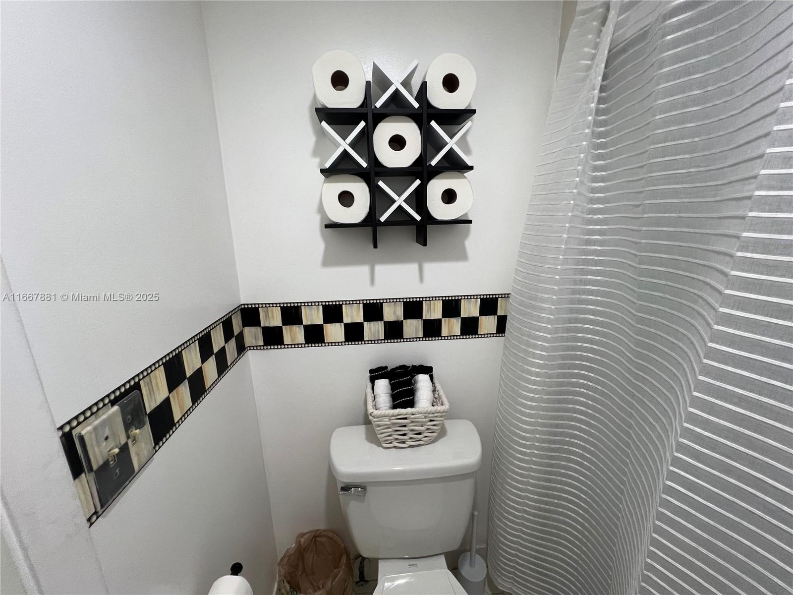 1280 Surf Road, Unit 103 Singer Island, FL 33404 - Photo 24 of 55 a bathroom with a toilet and a sink
