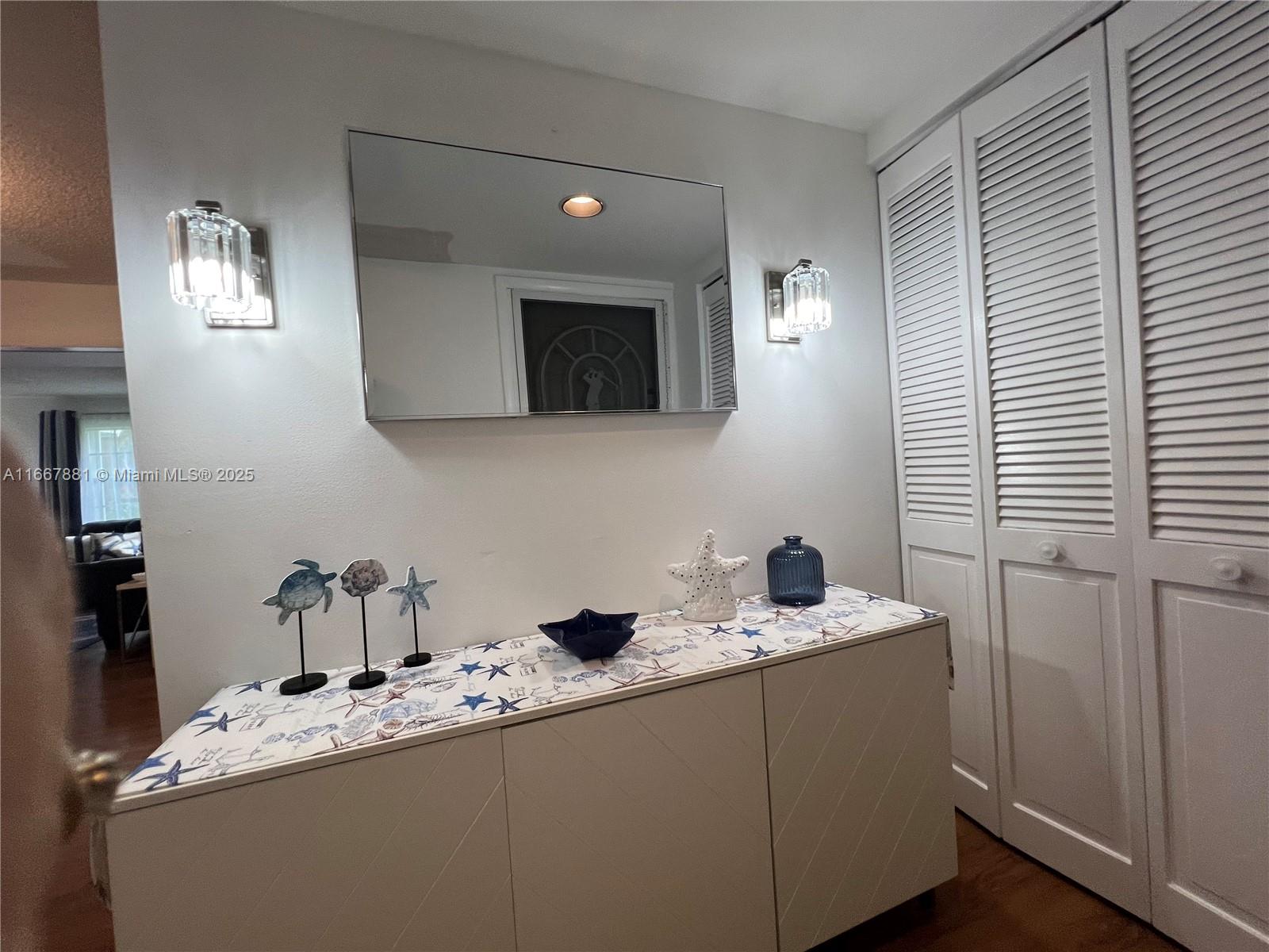 1280 Surf Road, Unit 103 Singer Island, FL 33404 - Photo 26 of 55 a bathroom with a sink and a mirror