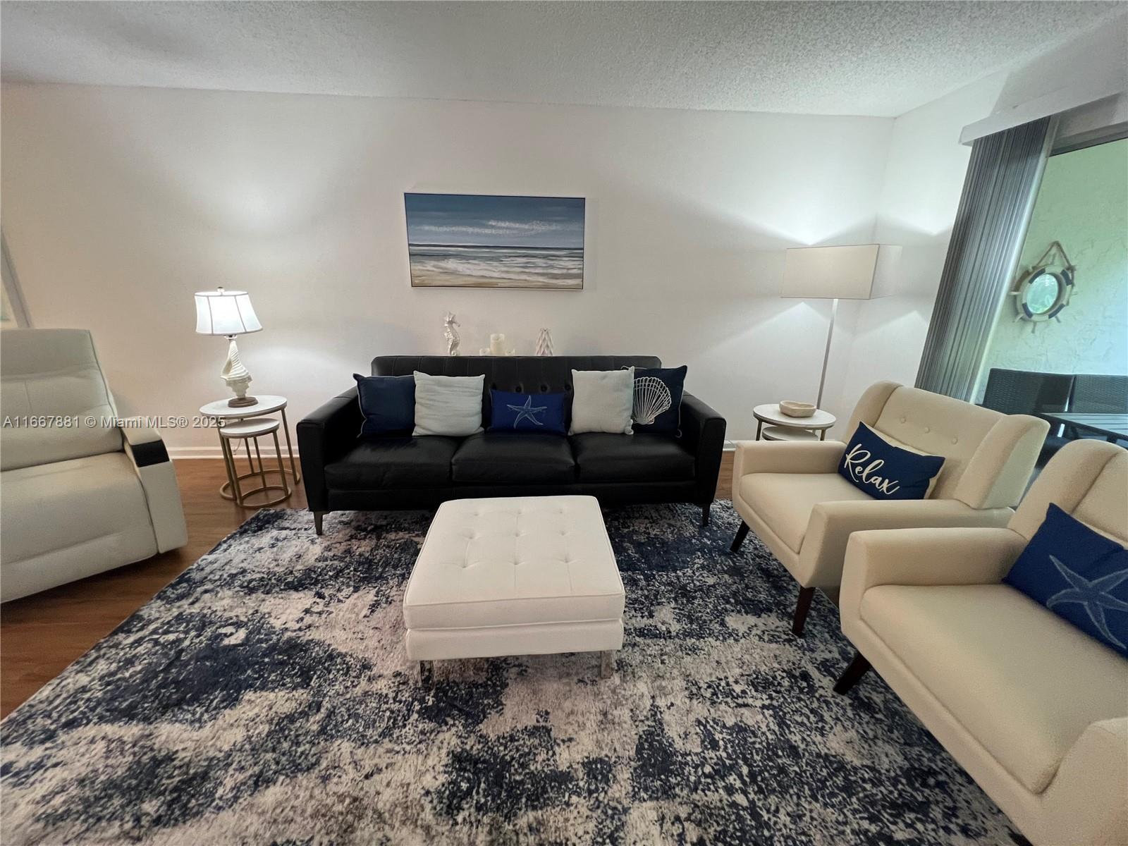 1280 Surf Road, Unit 103 Singer Island, FL 33404 - Photo 3 of 55 a living room with furniture and a couch