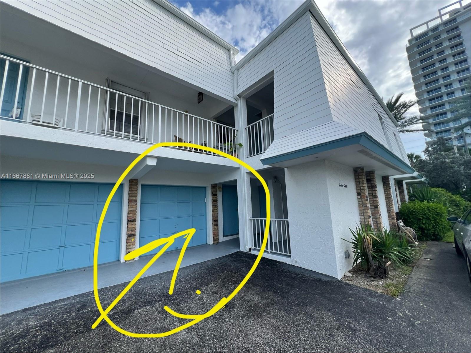 1280 Surf Road, Unit 103 Singer Island, FL 33404 - Photo 34 of 55 a view of a house with a small yard and wooden deck