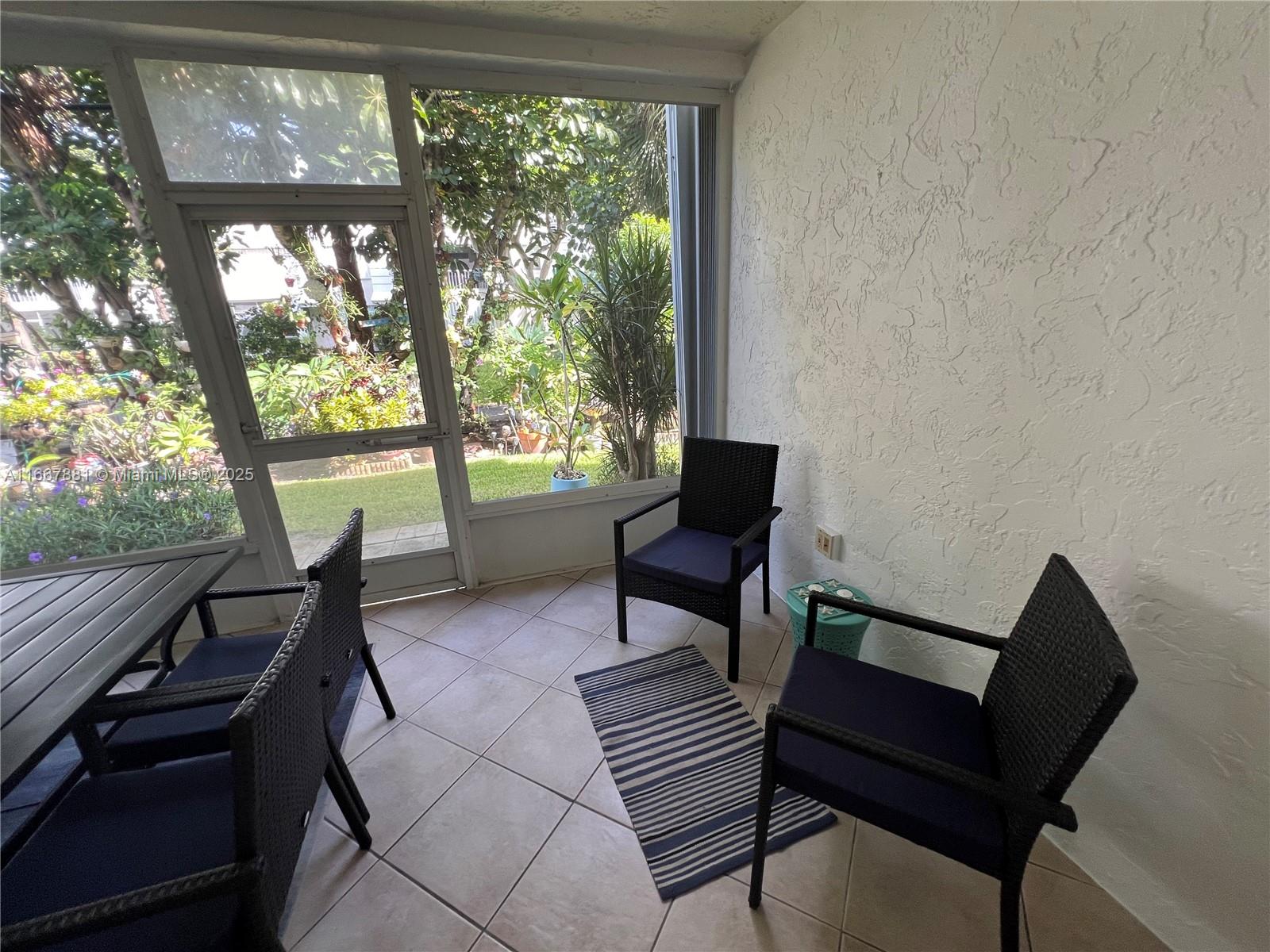1280 Surf Road, Unit 103 Singer Island, FL 33404 - Photo 35 of 55 a living room with furniture and a window