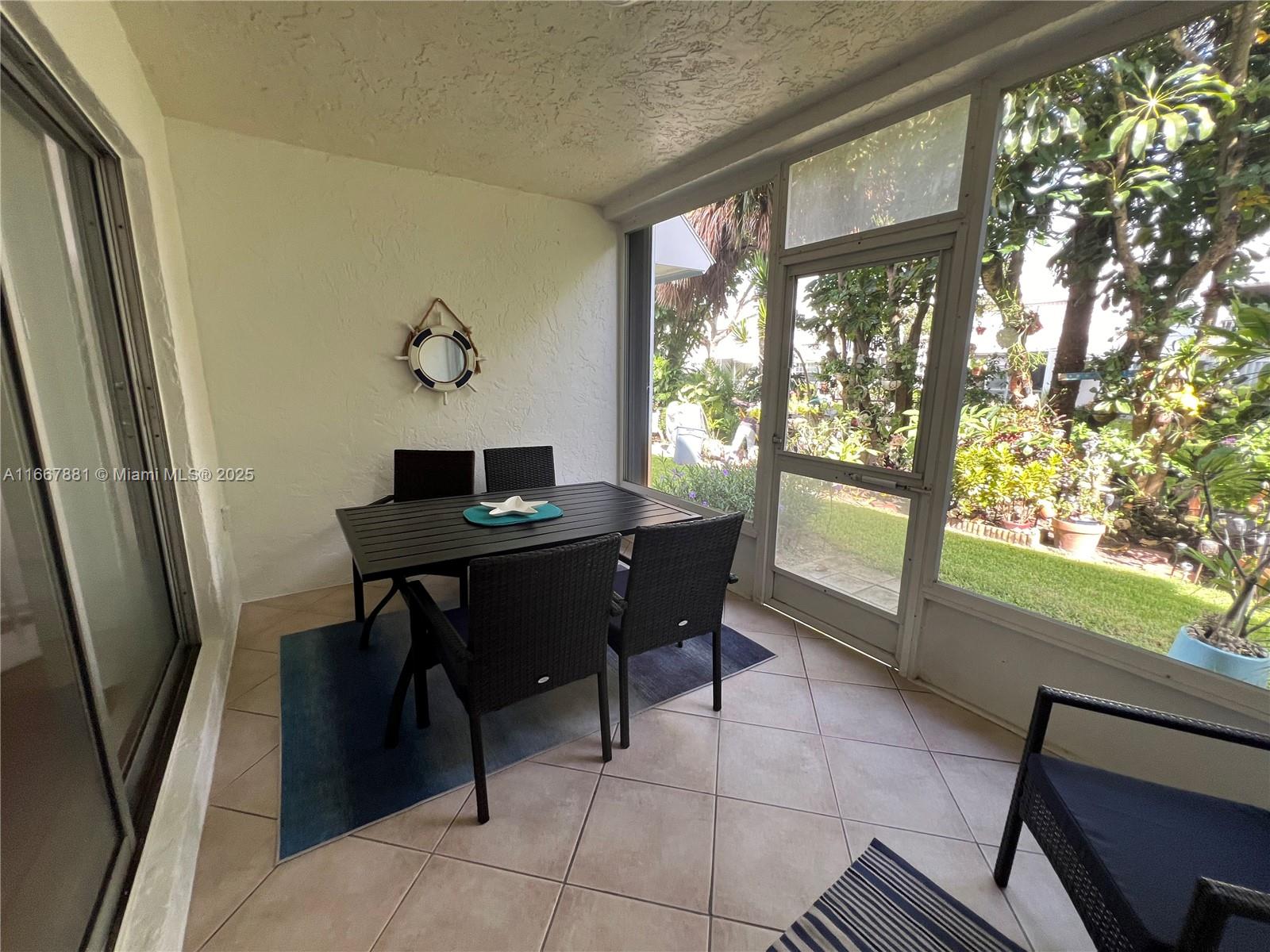 1280 Surf Road, Unit 103 Singer Island, FL 33404 - Photo 36 of 55 a view of a workspace with furniture and a window
