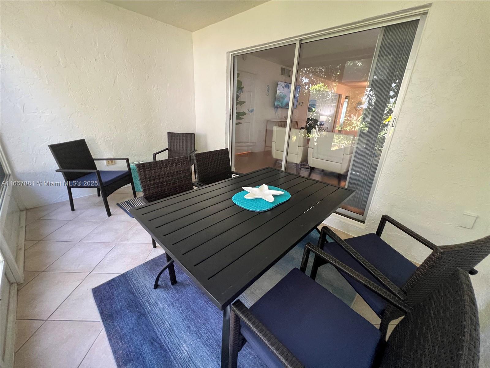 1280 Surf Road, Unit 103 Singer Island, FL 33404 - Photo 37 of 55 a living room with furniture and wooden floor