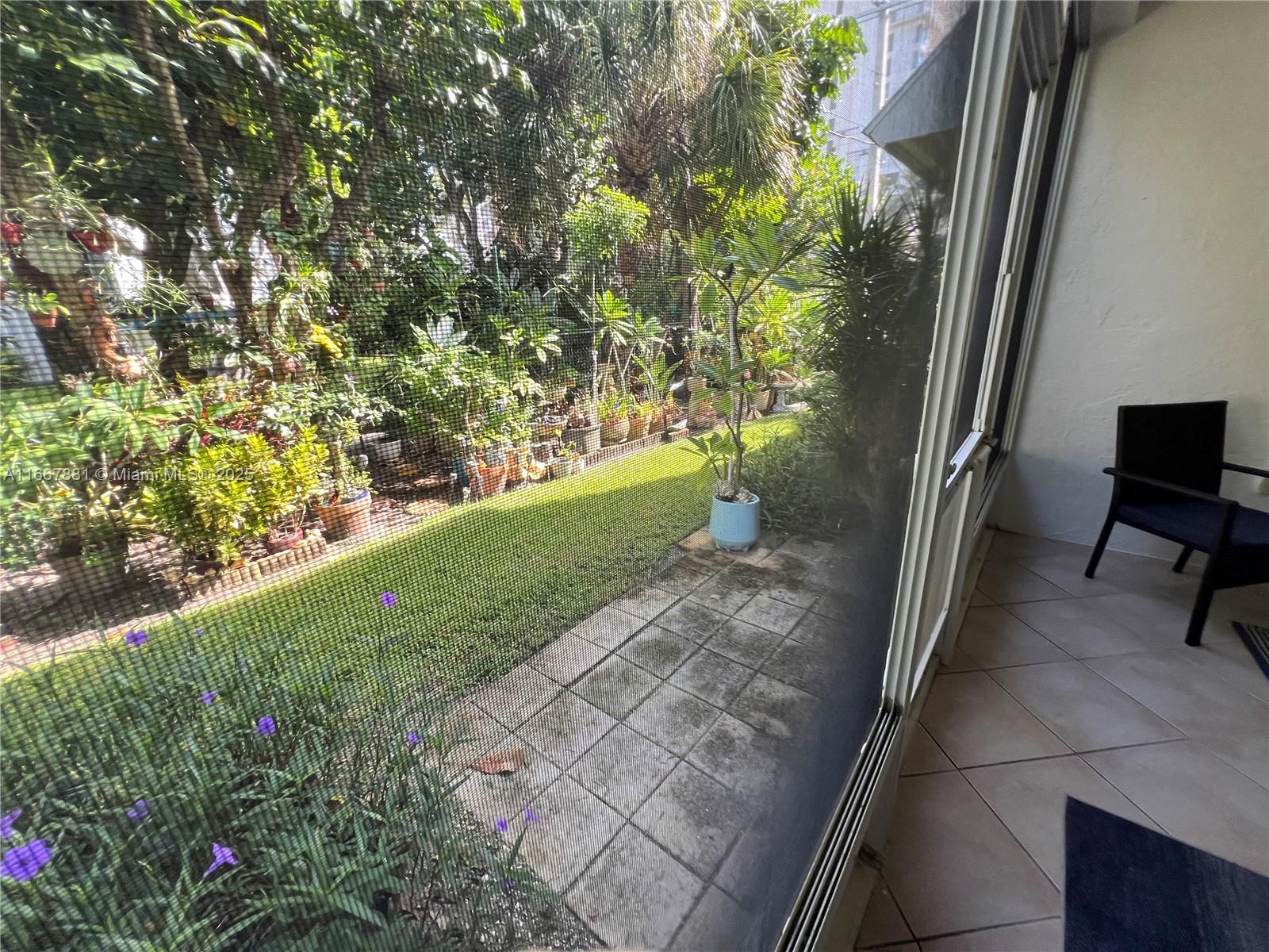 1280 Surf Road, Unit 103 Singer Island, FL 33404 - Photo 43 of 55 a view of backyard with green space