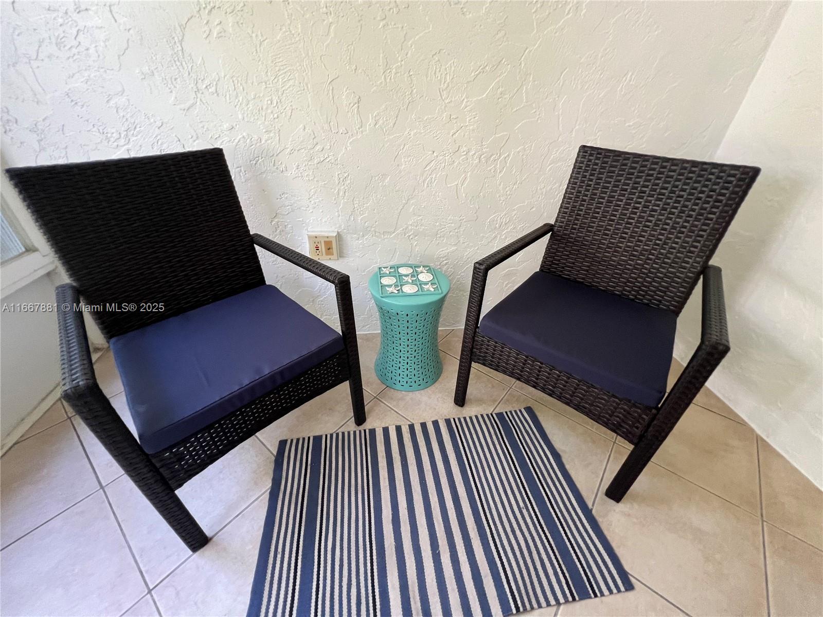 1280 Surf Road, Unit 103 Singer Island, FL 33404 - Photo 44 of 55 a view of a living room with chairs