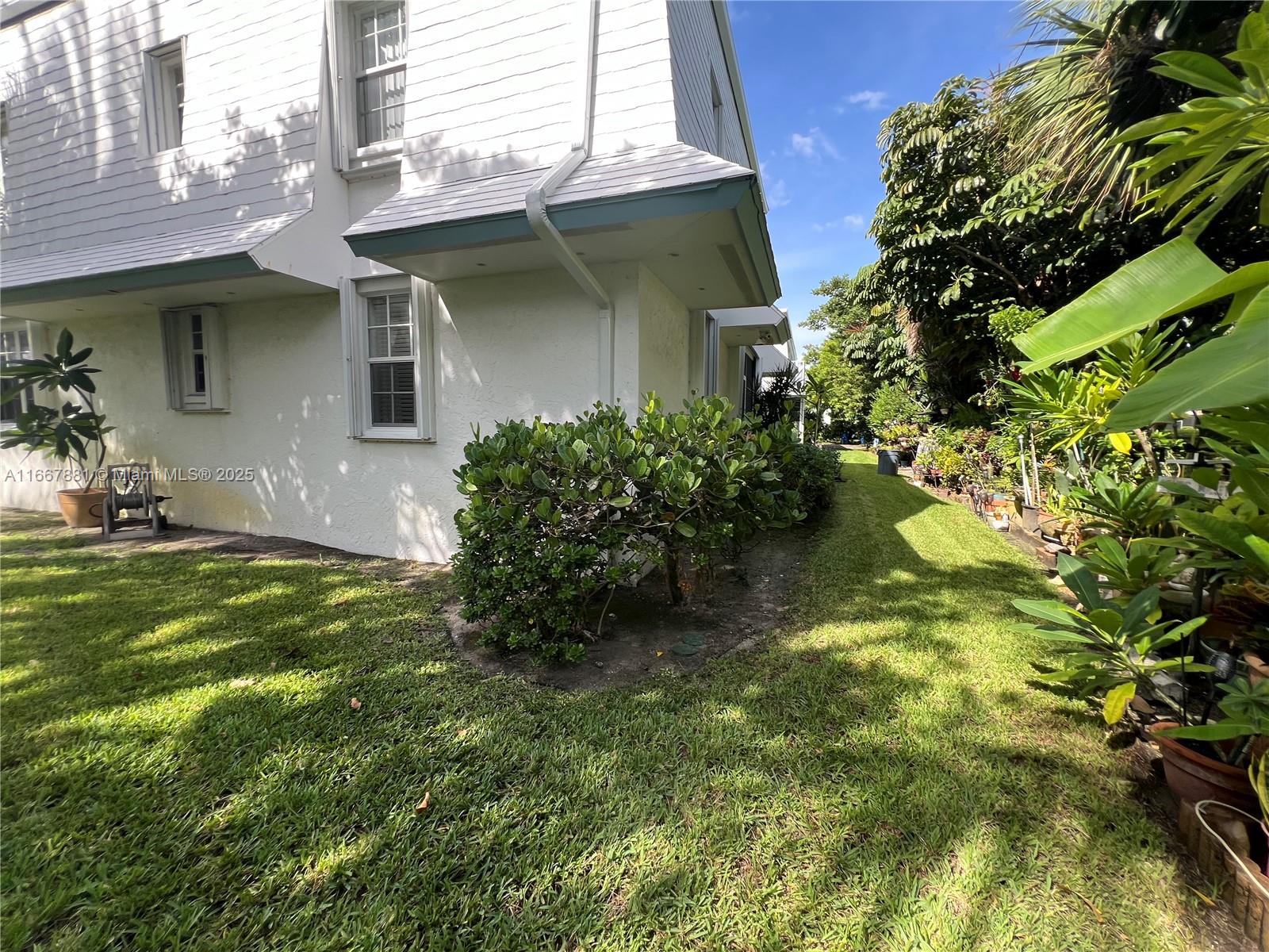 1280 Surf Road, Unit 103 Singer Island, FL 33404 - Photo 45 of 55 a view of a house with a yard
