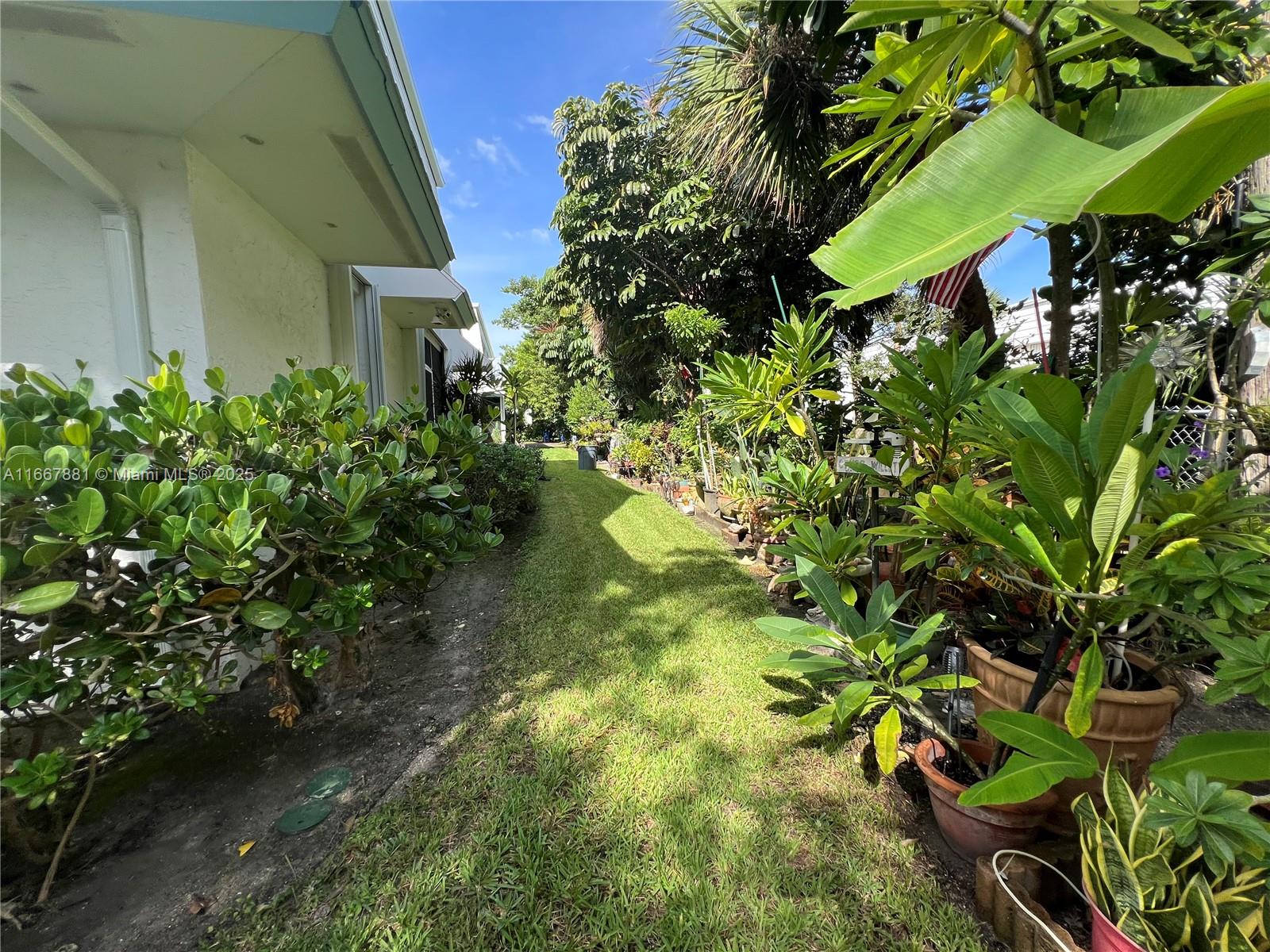 1280 Surf Road, Unit 103 Singer Island, FL 33404 - Photo 47 of 55 a view of a garden