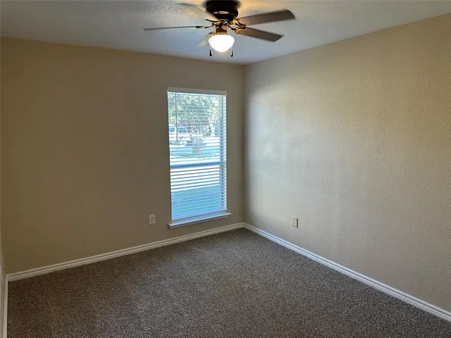a bathroom with a sink toilet and mirror