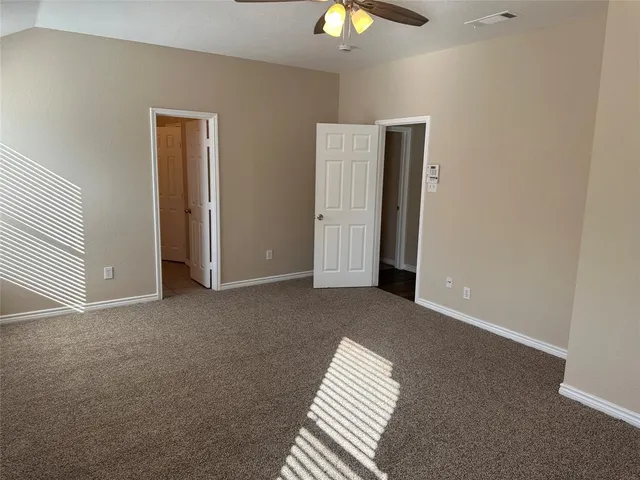 a bathroom with a tub double sink and mirror