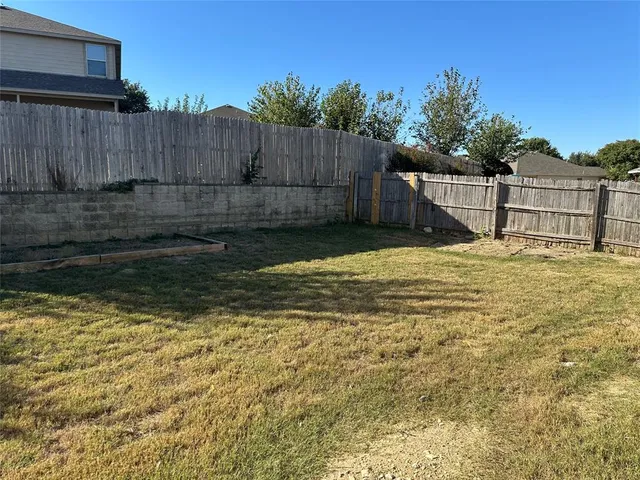 a view of a wooden fence