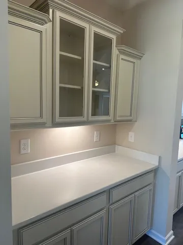 a close view of sink and cabinets