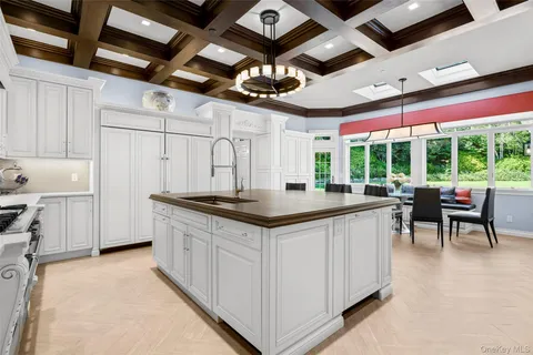 a kitchen with stainless steel appliances granite countertop a stove and a refrigerator