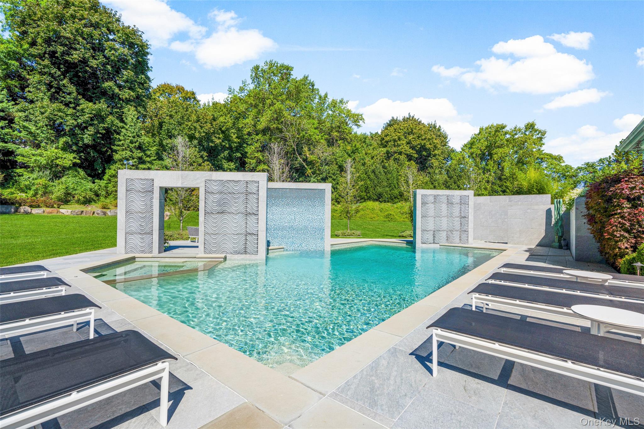 23 Pheasant Drive Rye, NY 10580 - Photo 28 of 30 Surrounded by matures trees, this pool is a private sanctuary in the heart of Rye, New York