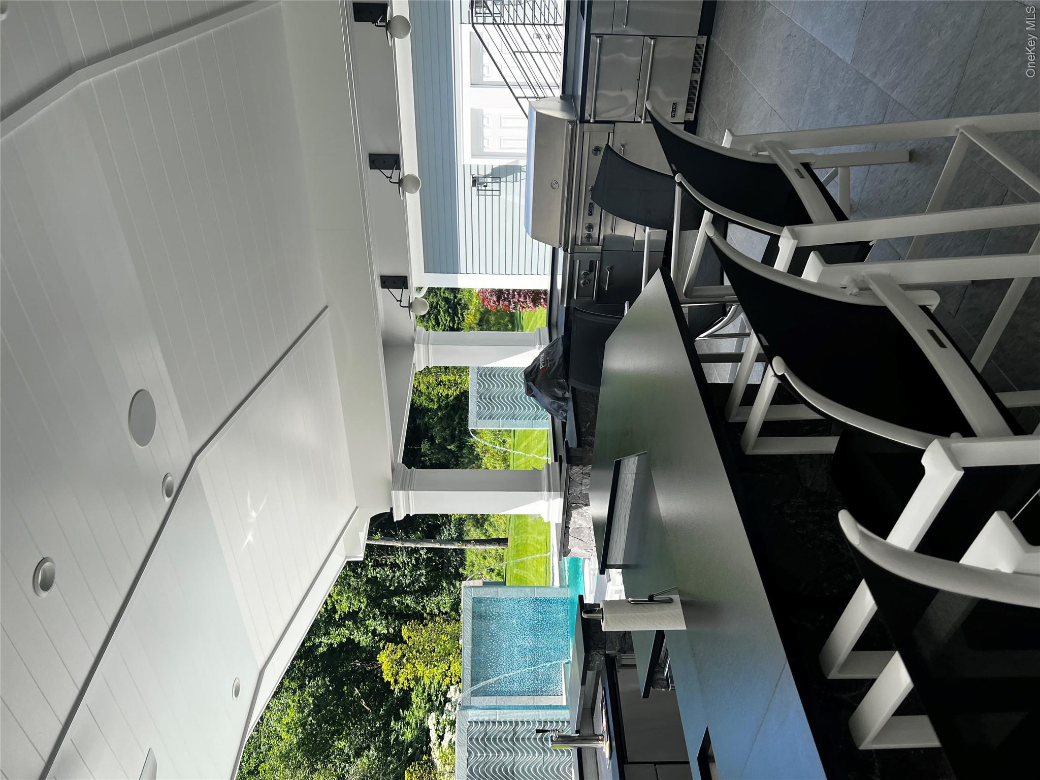 23 Pheasant Drive Rye, NY 10580 - Photo 29 of 35 Expansive Wet Bar with large dining area