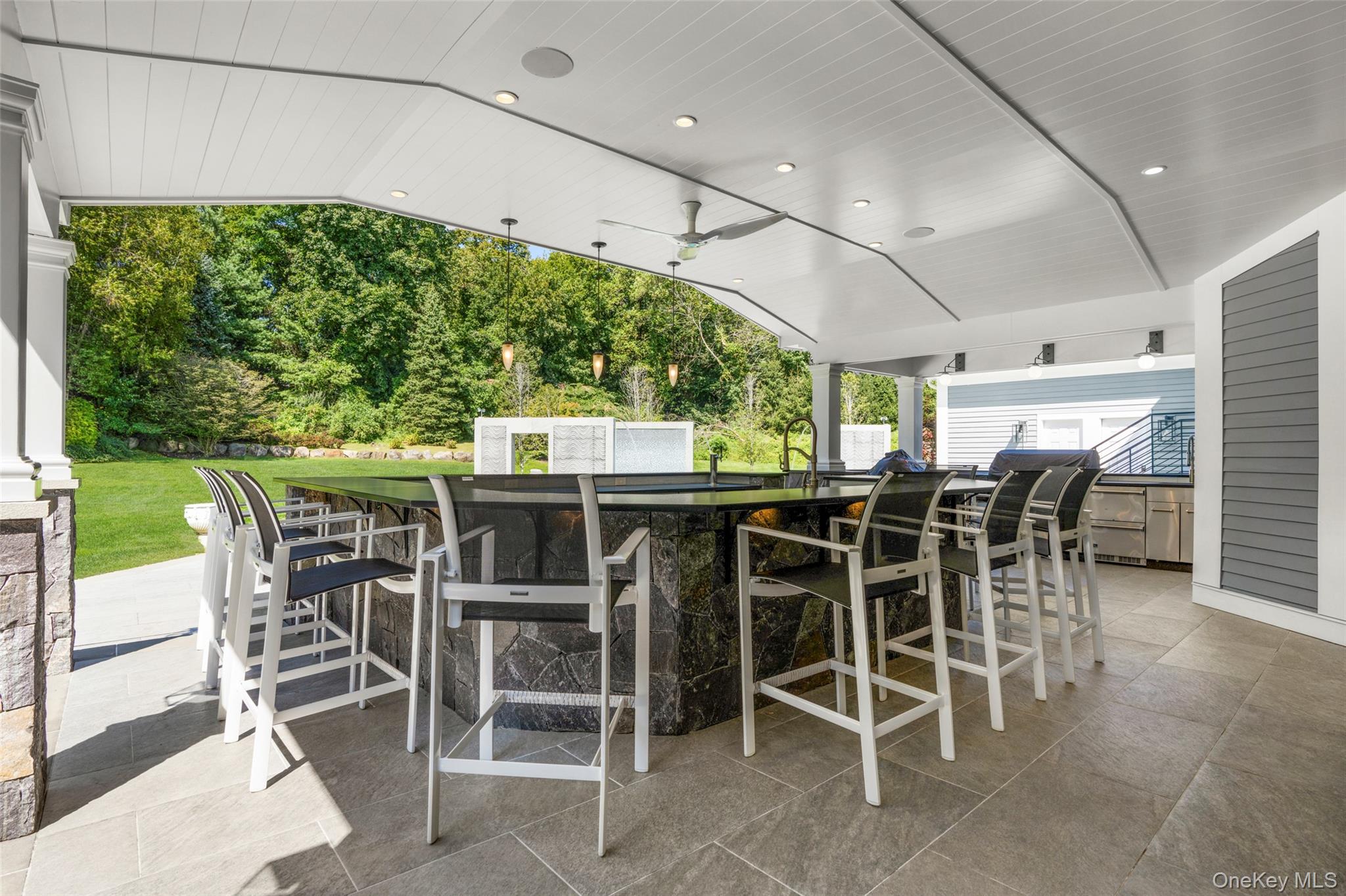23 Pheasant Drive Rye, NY 10580 - Photo 31 of 35 Over sized bar with refrigerator, ice maker and kegerator. Lounge area with television and sonos system for resort style summer enjoyment