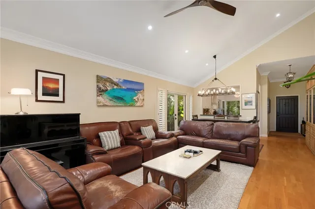 a living room with furniture ceiling fan and a rug