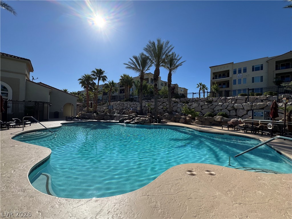 2555 Hampton Road, Unit 4205 Henderson, NV 89052 - Photo 4 of 52 Relax and unwind by this inviting pool, surrounded by lush landscaping and scenic architecture.