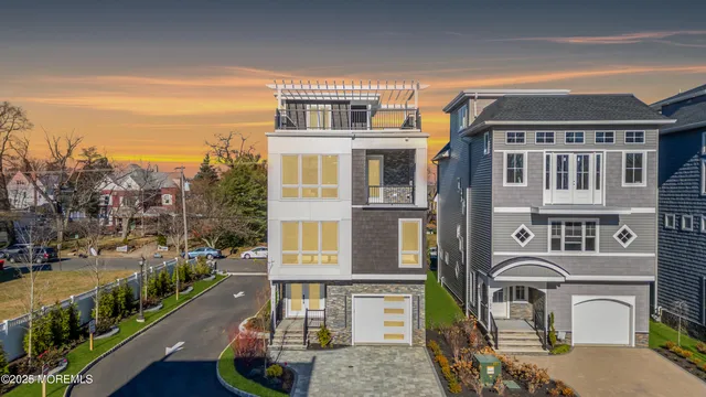 a large kitchen with kitchen island a large counter top space a sink stainless steel appliances and cabinets