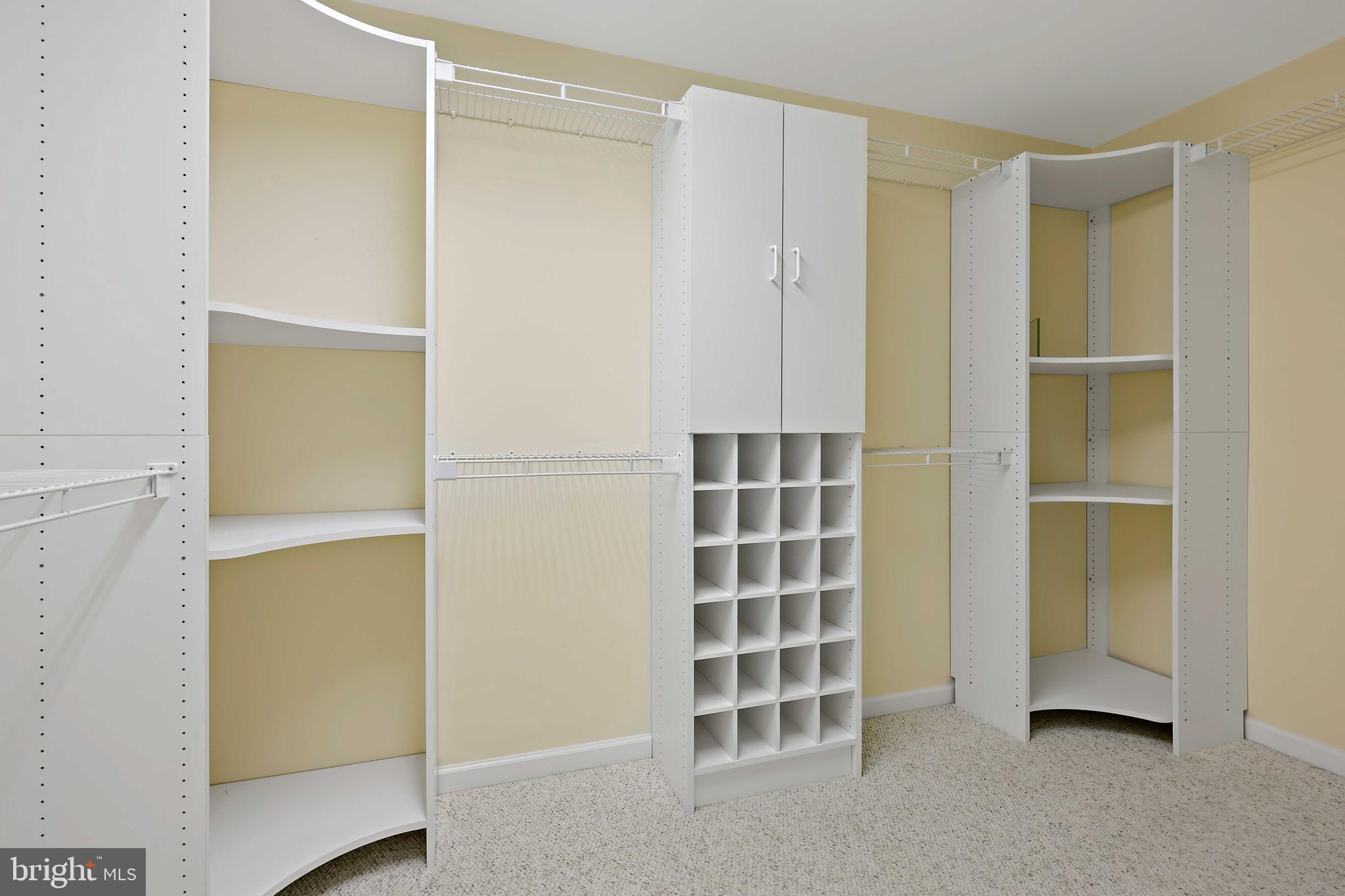 253 Woodard Road Arnold, MD 21012 - Photo 25 of 55 Built in shelves and cabinets walk-in closet