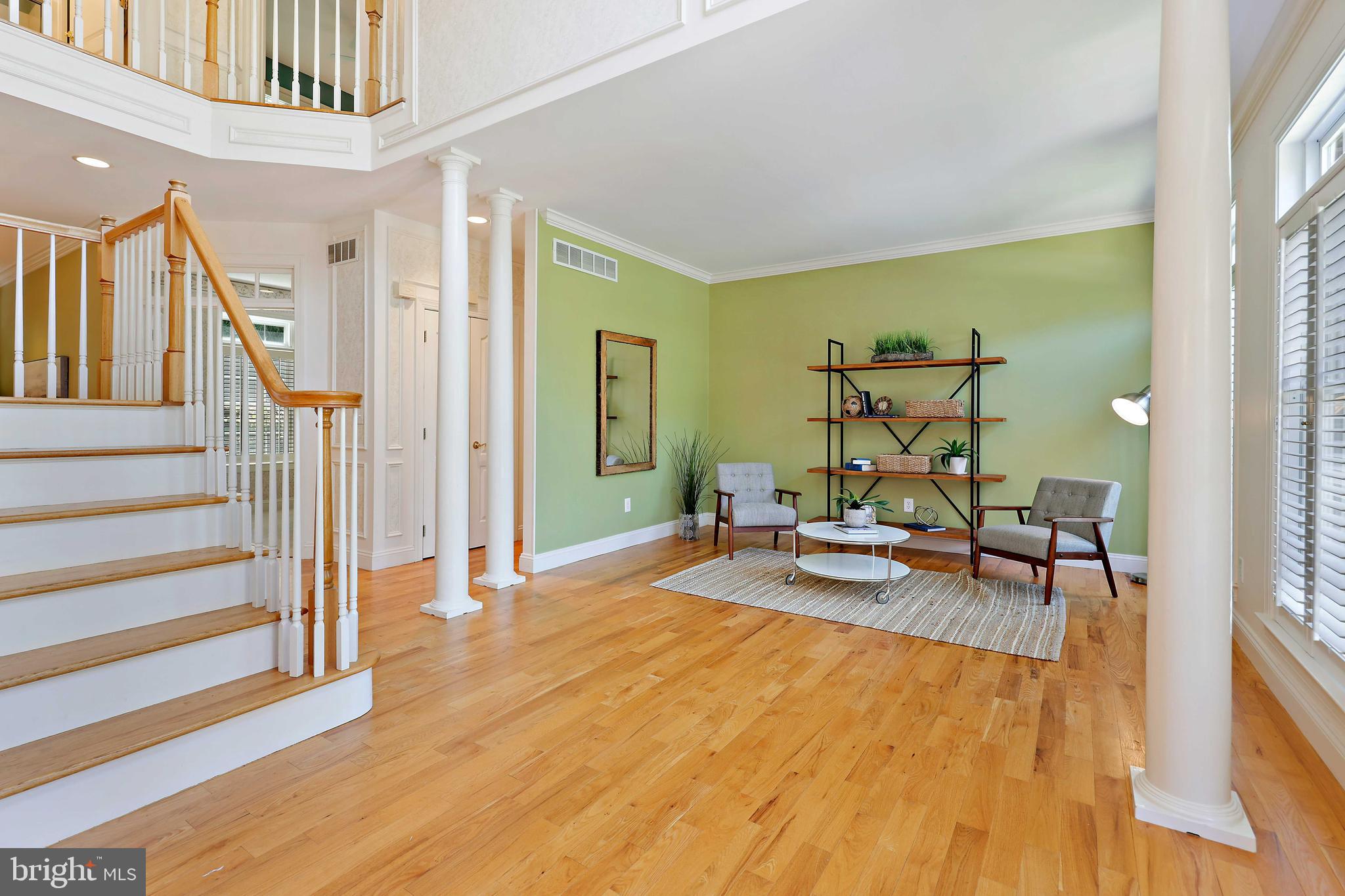 Stairs with view of sitting room