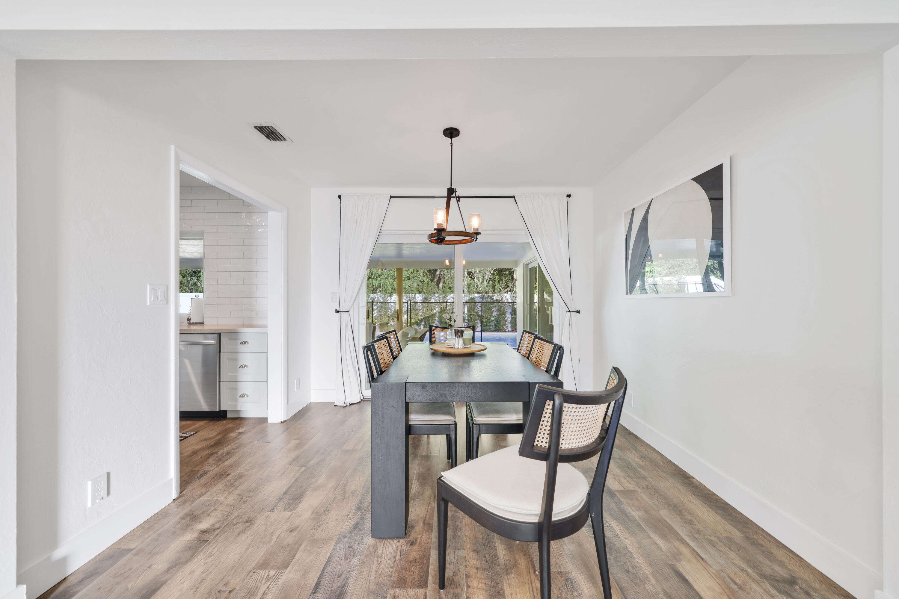 632 East Conference Drive Boca Raton, FL 33486 - Photo 10 of 49 a view of a dining room with furniture window and wooden floor