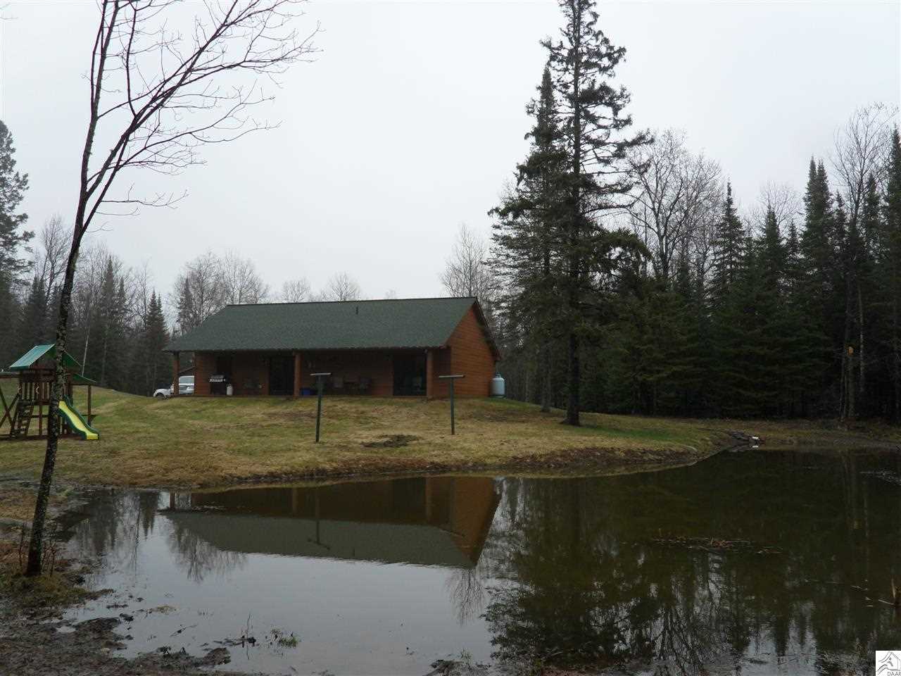 7509 Pequaywan Lake Road Duluth, MN 55803 - Photo 2 of 12 Rear w/Pond