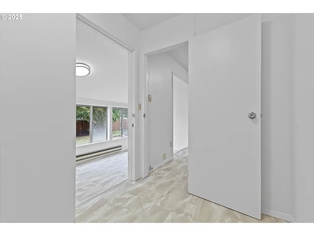 a view of an empty room with a window