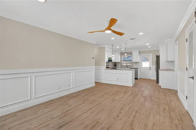 a view of kitchen with wooden floor
