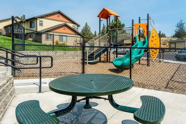 a view of a chairs and table in the patio