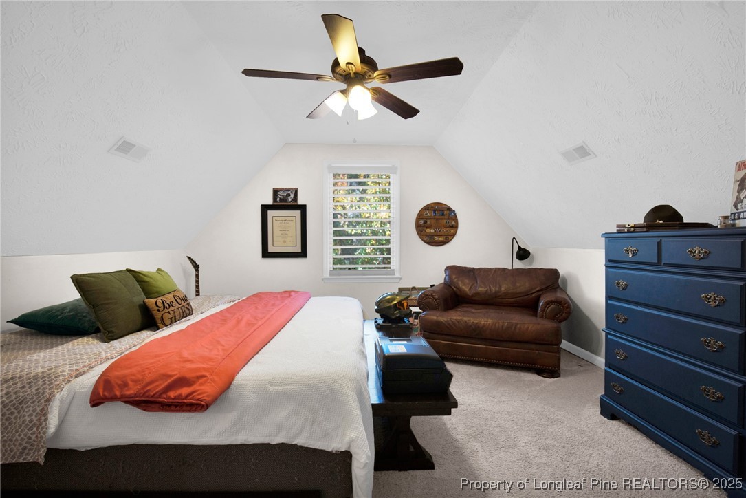 529 Old Farm Road Fayetteville, NC 28314 - Photo 25 of 35 a bedroom with a bed and ceiling fan