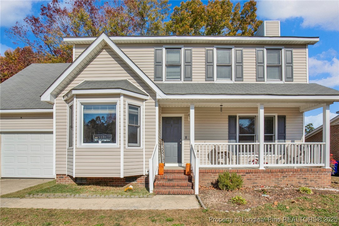529 Old Farm Road Fayetteville, NC 28314 - Photo 5 of 35 a view of a brick house with yard and plants