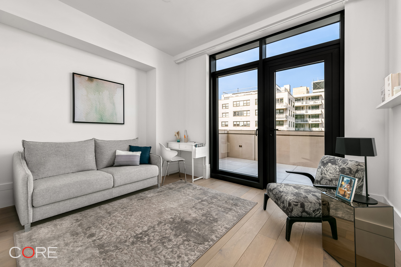 310 East 86th Street, Unit 19C Manhattan, NY 10028 - Photo 8 of 20 a living room with furniture and a window