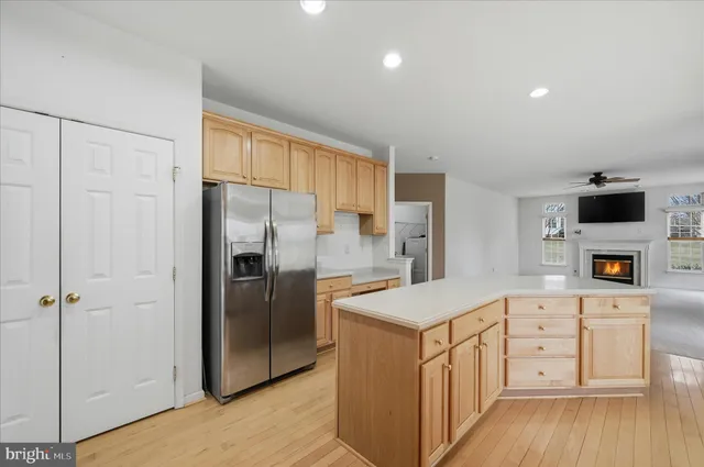 a bathroom with a walk in closet and a fireplace