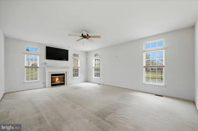 a view of a livingroom with a kitchen and a stove top oven