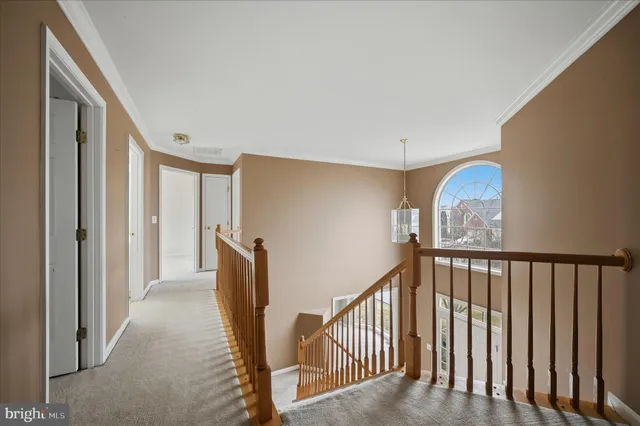 a spacious bathroom with double sink and a mirror