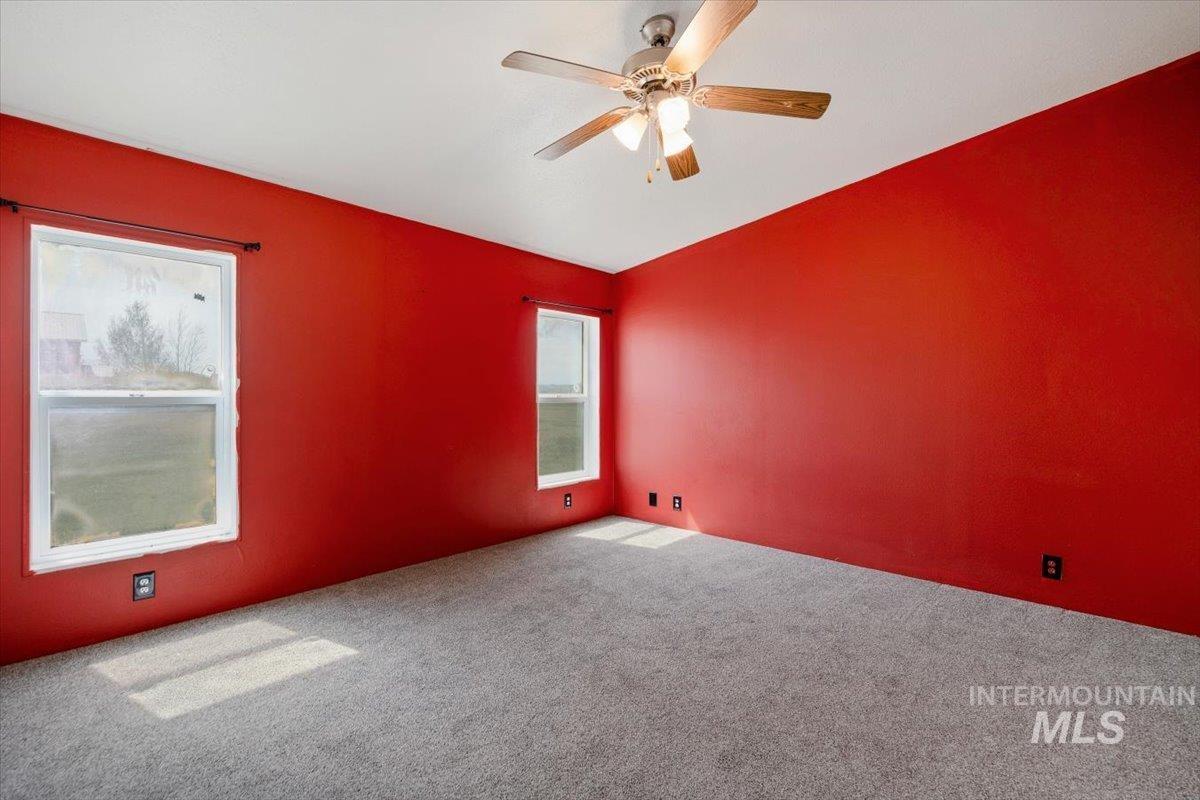 501 Timber Avenue Fairfield, ID 83327 - Photo 13 of 27 Empty room with carpet and a ceiling fan