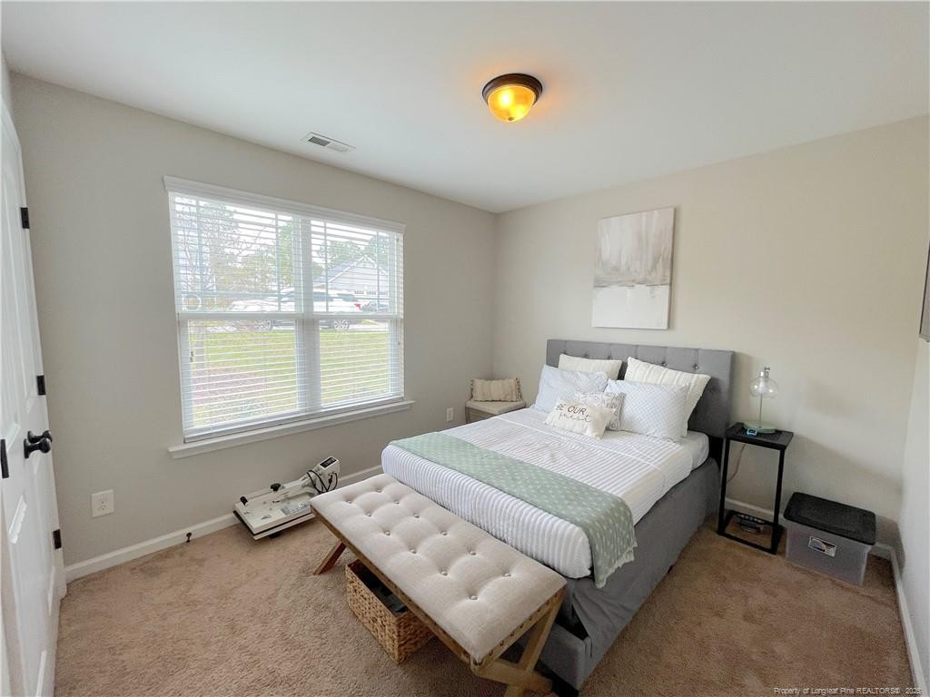 178 Angel Oak Drive Bunnlevel, NC 28323 - Photo 11 of 15 a bedroom with a bed and a window