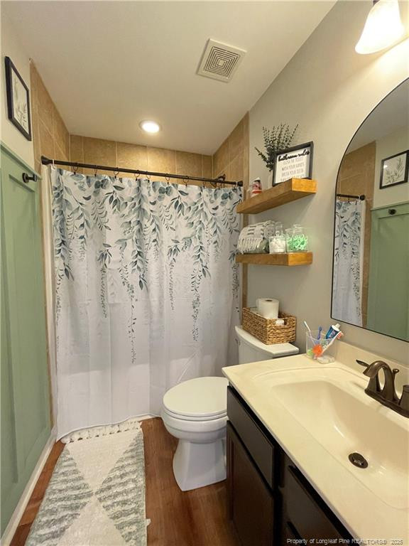 178 Angel Oak Drive Bunnlevel, NC 28323 - Photo 12 of 15 a bathroom with a sink toilet a mirror and shower