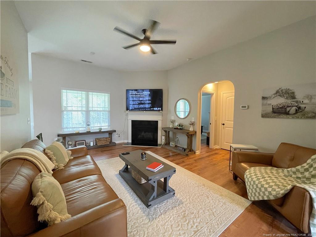 178 Angel Oak Drive Bunnlevel, NC 28323 - Photo 3 of 15 a living room with furniture a fireplace and a window