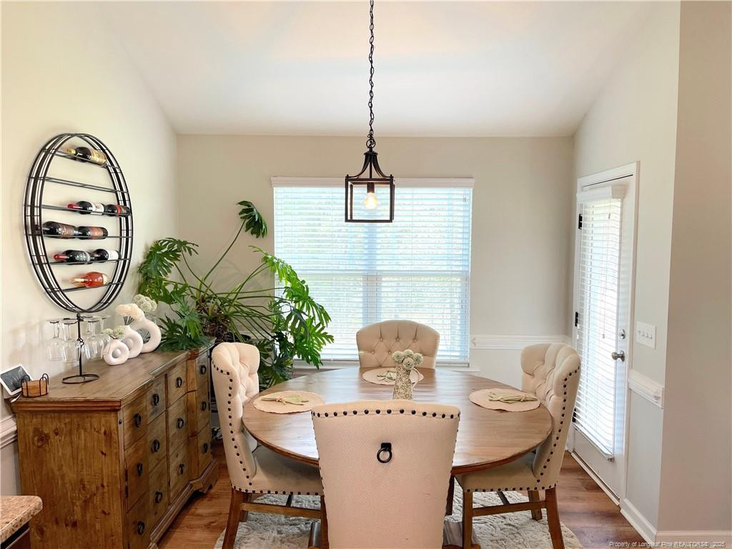 178 Angel Oak Drive Bunnlevel, NC 28323 - Photo 7 of 15 a view of a dining room with furniture window and wooden floor