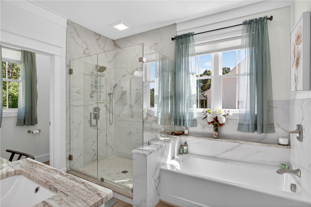 921 Falling Waters Lane Seneca, SC 29672 - Photo 24 of 46 Luxurious bathing quarters with walk-in shower and separate soaking tub.