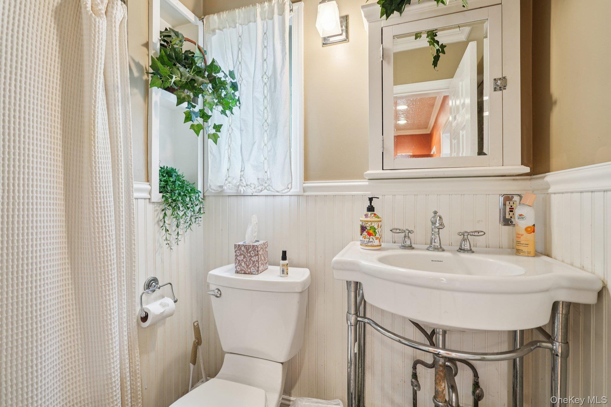 74 East Maple Avenue Suffern, NY 10901 - Photo 19 of 50 Full bath featuring toilet and a wainscoted wall