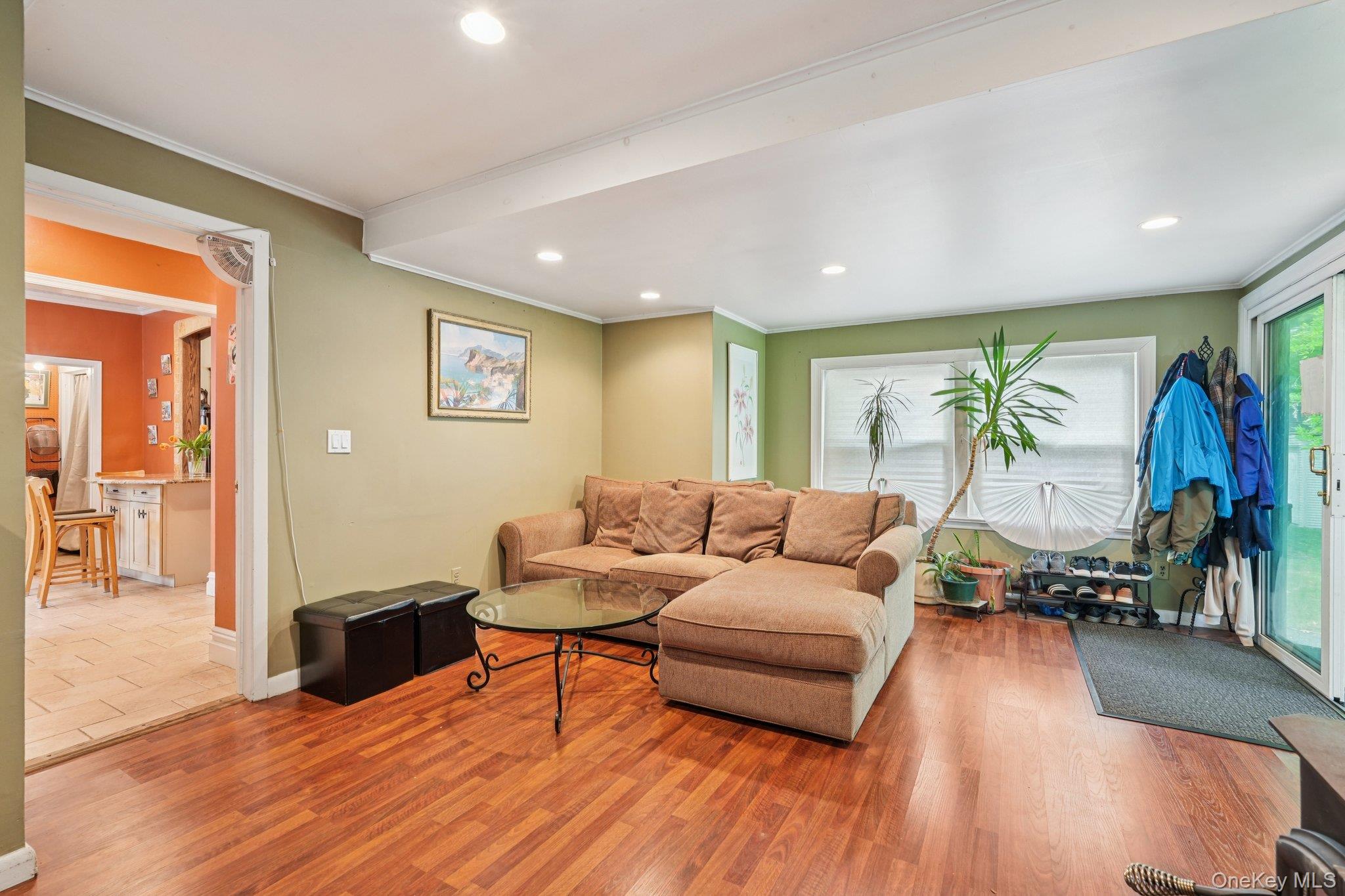 74 East Maple Avenue Suffern, NY 10901 - Photo 23 of 50 Living area featuring wood finished floors, recessed lighting, and ornamental molding