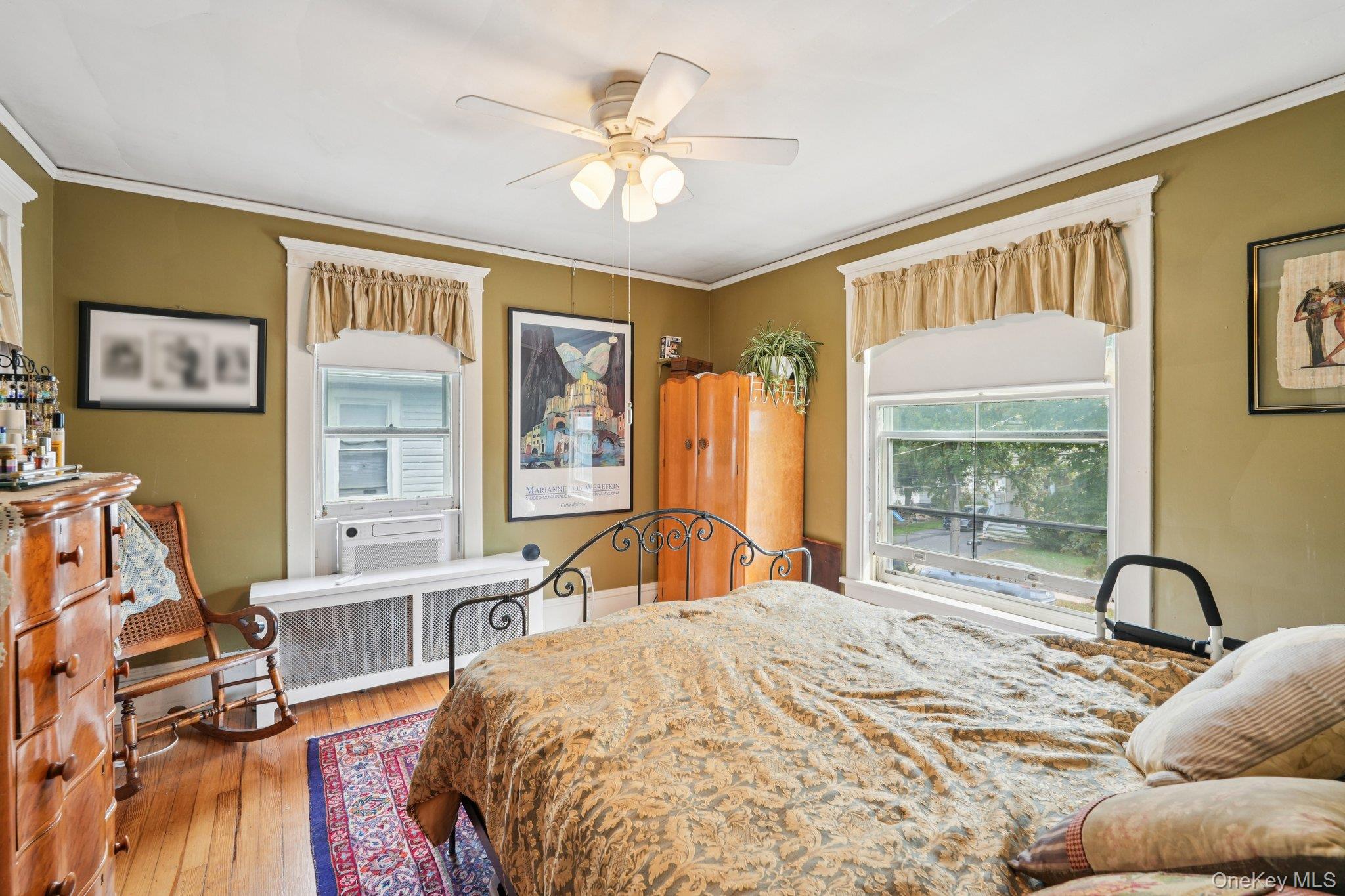 74 East Maple Avenue Suffern, NY 10901 - Photo 24 of 50 Bedroom featuring crown molding, light wood-style floors, radiator heating unit, and ceiling fan