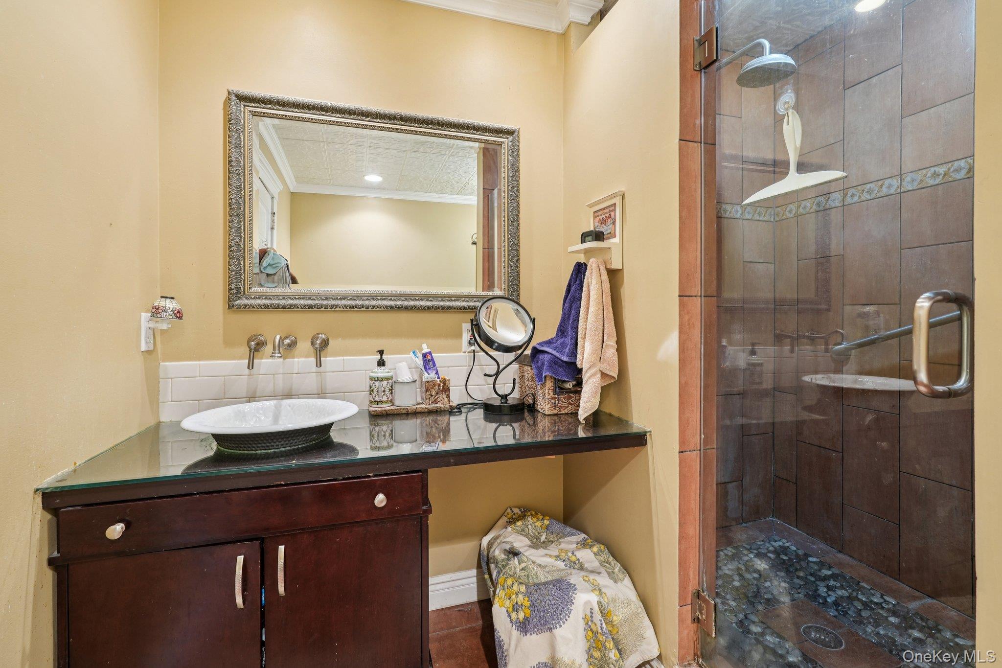 74 East Maple Avenue Suffern, NY 10901 - Photo 28 of 50 Bathroom featuring a shower stall, ornamental molding, and vanity