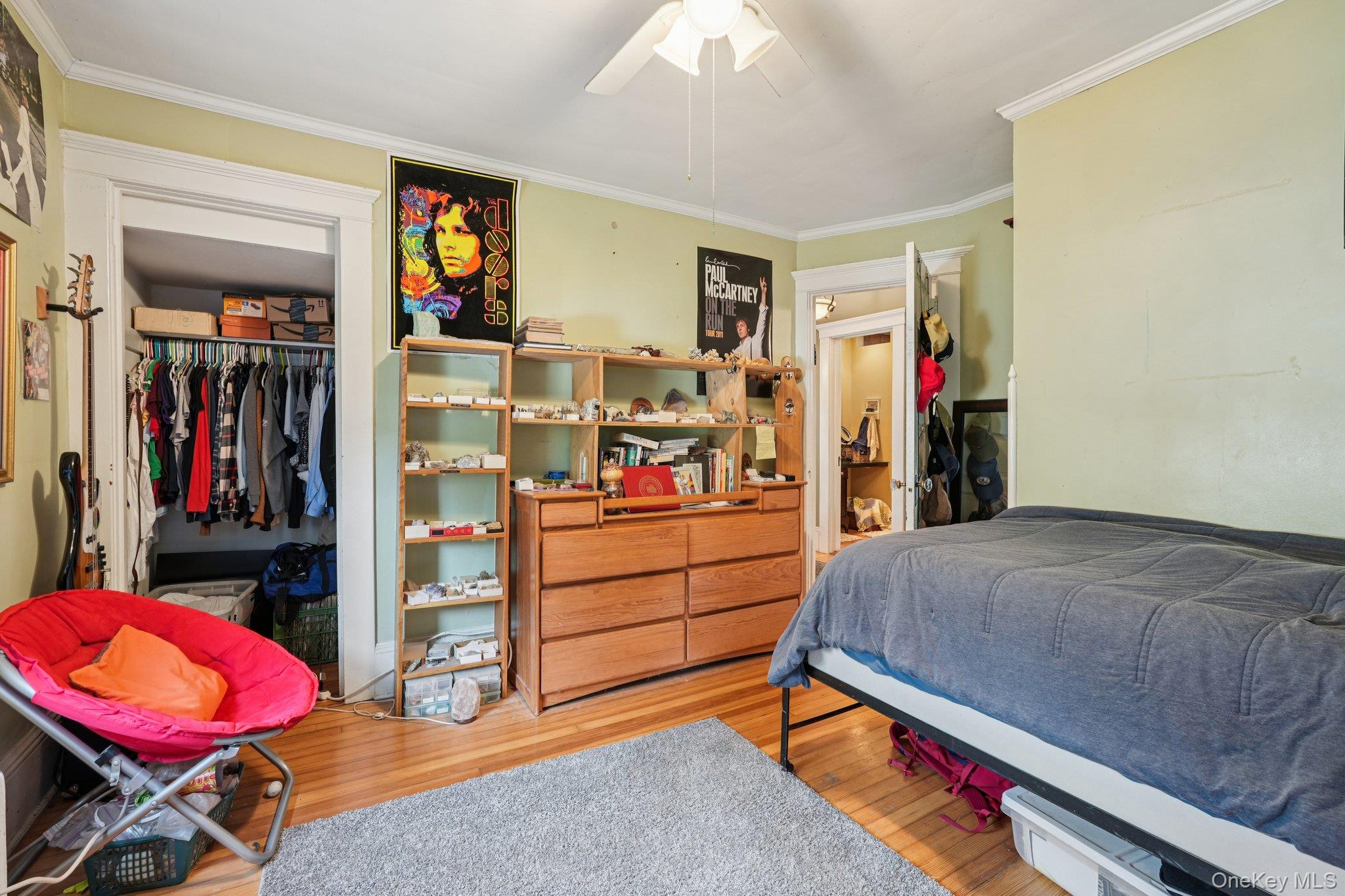 74 East Maple Avenue Suffern, NY 10901 - Photo 34 of 50 Bedroom with light wood-type flooring, crown molding, a closet, and a ceiling fan